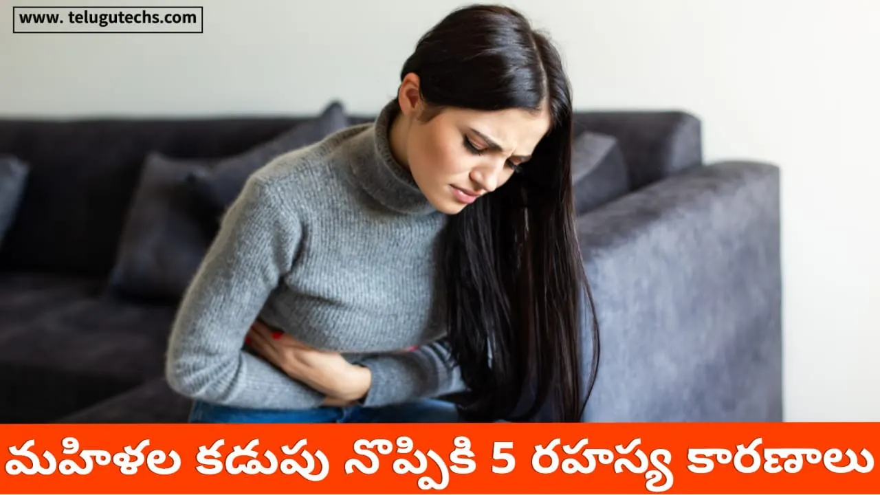 stomach pain causes - Woman holding stomach in pain – possible causes in women like UTI, endometriosis, ulcers.